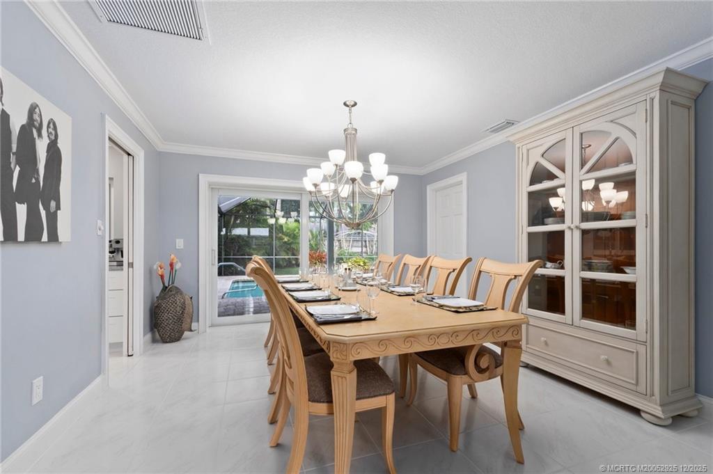 20 Banyan Road Stuart, FL 34996 - Photo 20 of 95 a view of a dining room with furniture window and outside view