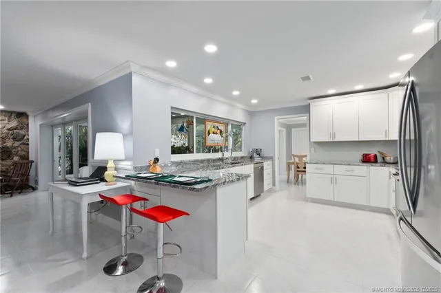 a room with a bed and a large window