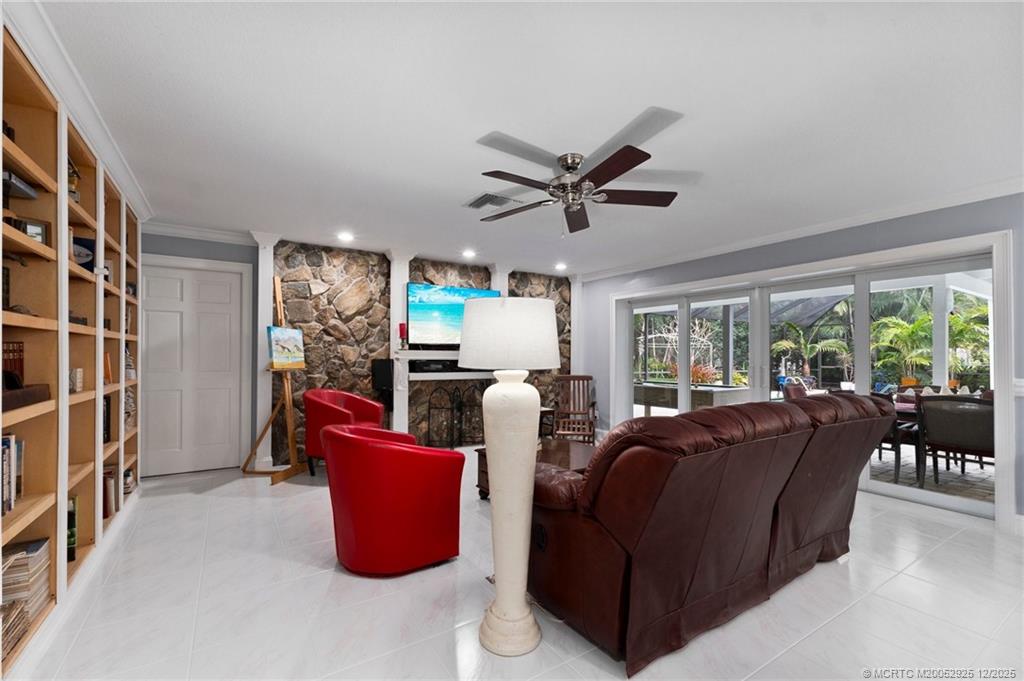 20 Banyan Road Stuart, FL 34996 - Photo 30 of 95 a living room with furniture and a large window