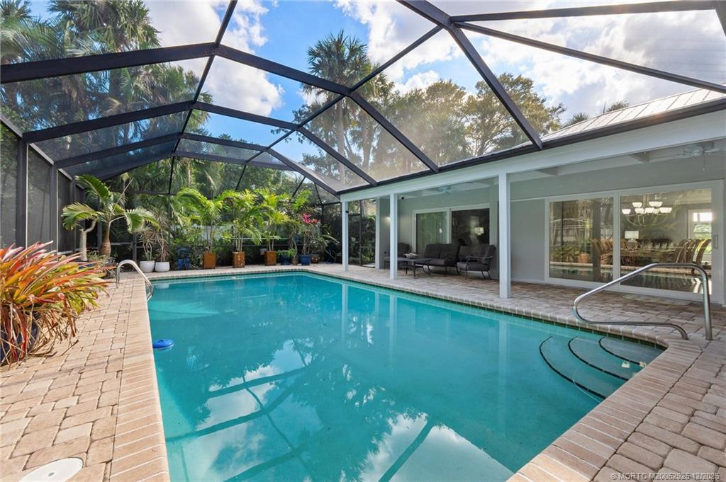 20 Banyan Road Stuart, FL 34996 - Photo 3 of 95 a view of a swimming pool with a patio
