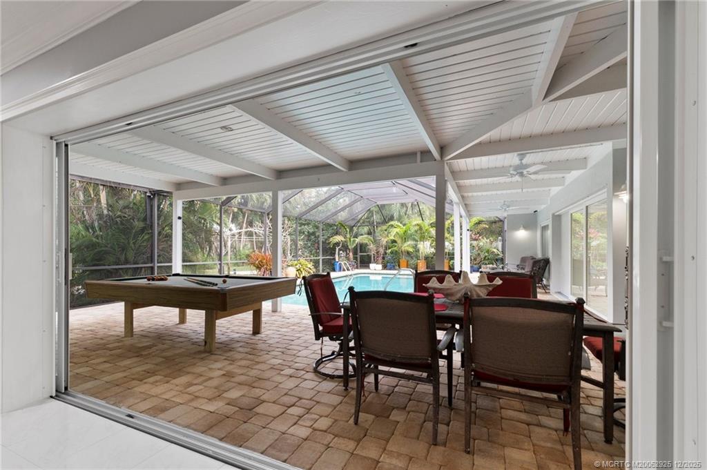 20 Banyan Road Stuart, FL 34996 - Photo 34 of 95 a dining room with furniture wooden floor and a rug