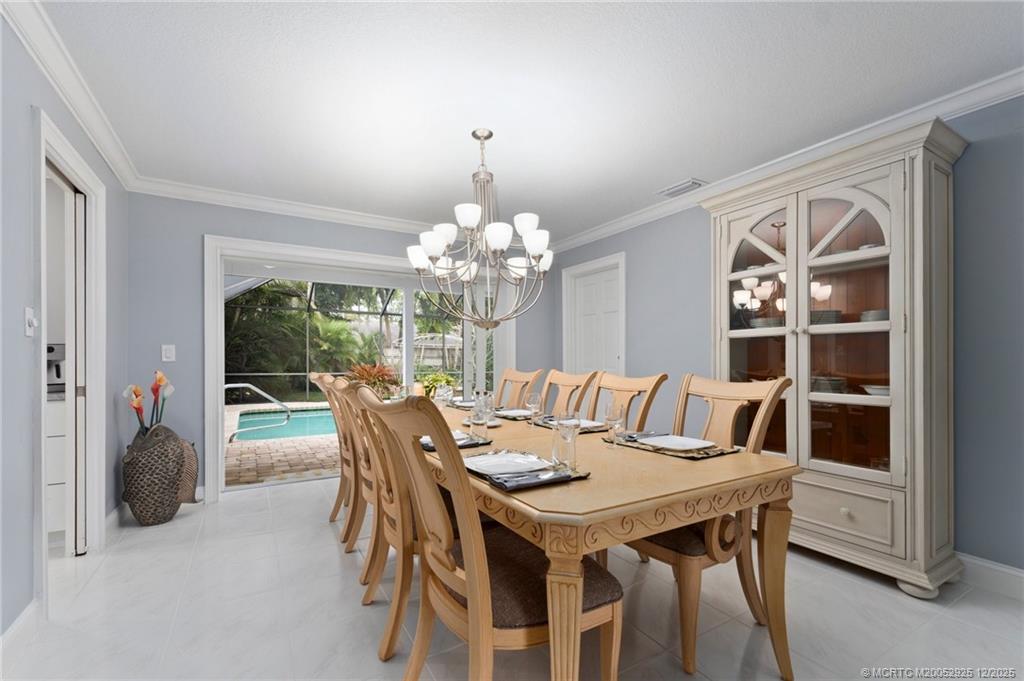 20 Banyan Road Stuart, FL 34996 - Photo 35 of 95 a view of a dining room with furniture window and outside view