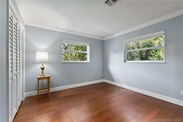 a view of a street with palm trees