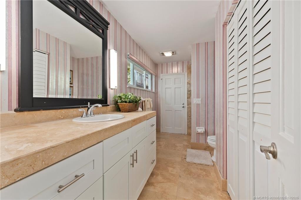 20 Banyan Road Stuart, FL 34996 - Photo 47 of 95 a bathroom with a granite countertop sink mirror and double