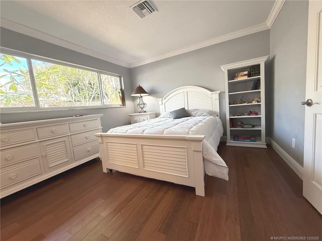 20 Banyan Road Stuart, FL 34996 - Photo 51 of 95 a room with a bed and a large window