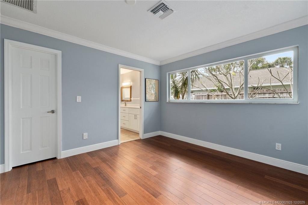 20 Banyan Road Stuart, FL 34996 - Photo 52 of 95 an empty room with wooden floor and windows