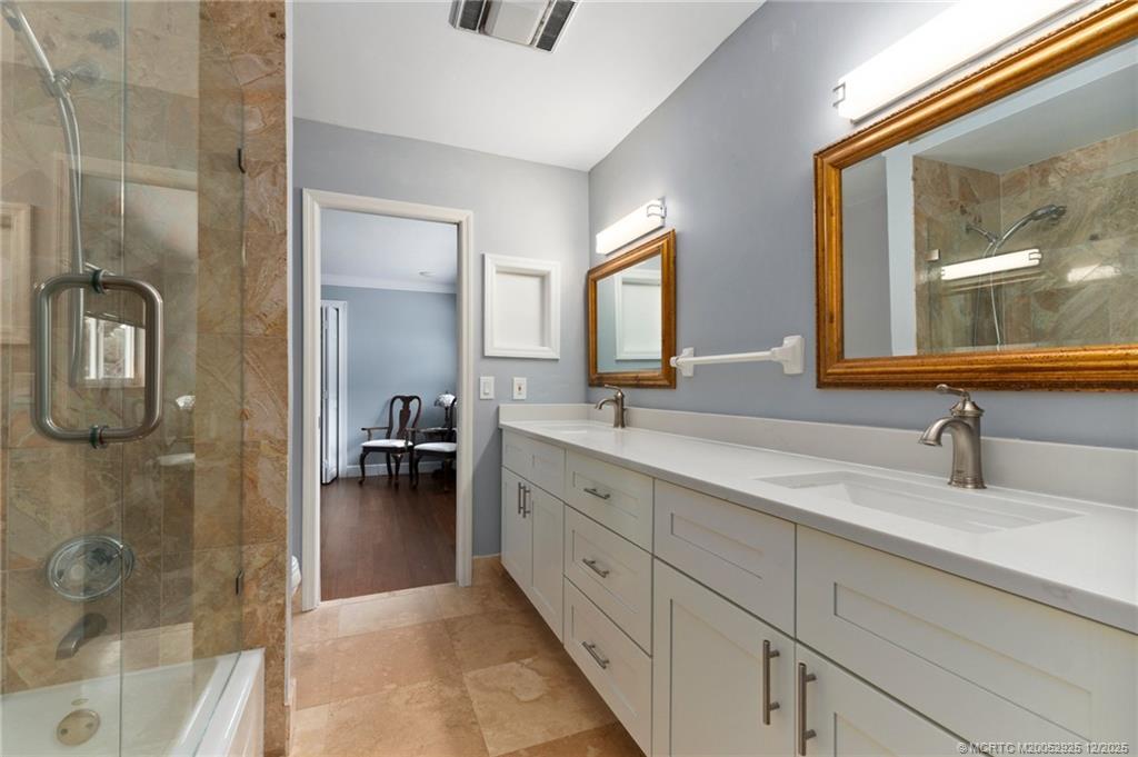 20 Banyan Road Stuart, FL 34996 - Photo 53 of 95 a en suite bathroom with a double vanity sink and a mirror
