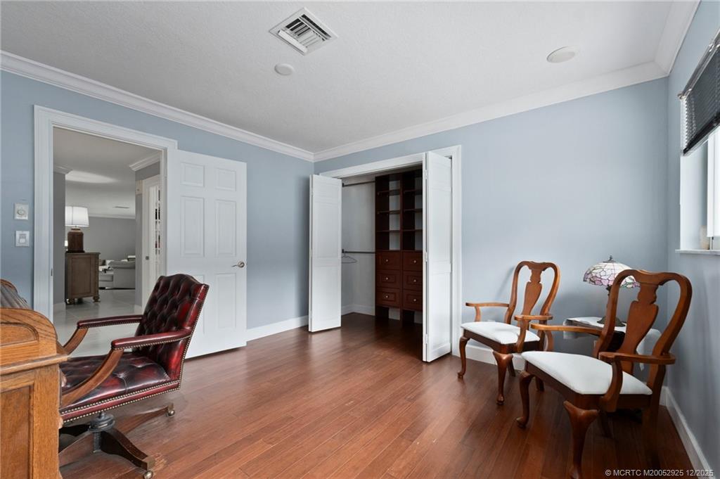 20 Banyan Road Stuart, FL 34996 - Photo 56 of 95 a dining room with furniture and wooden floor