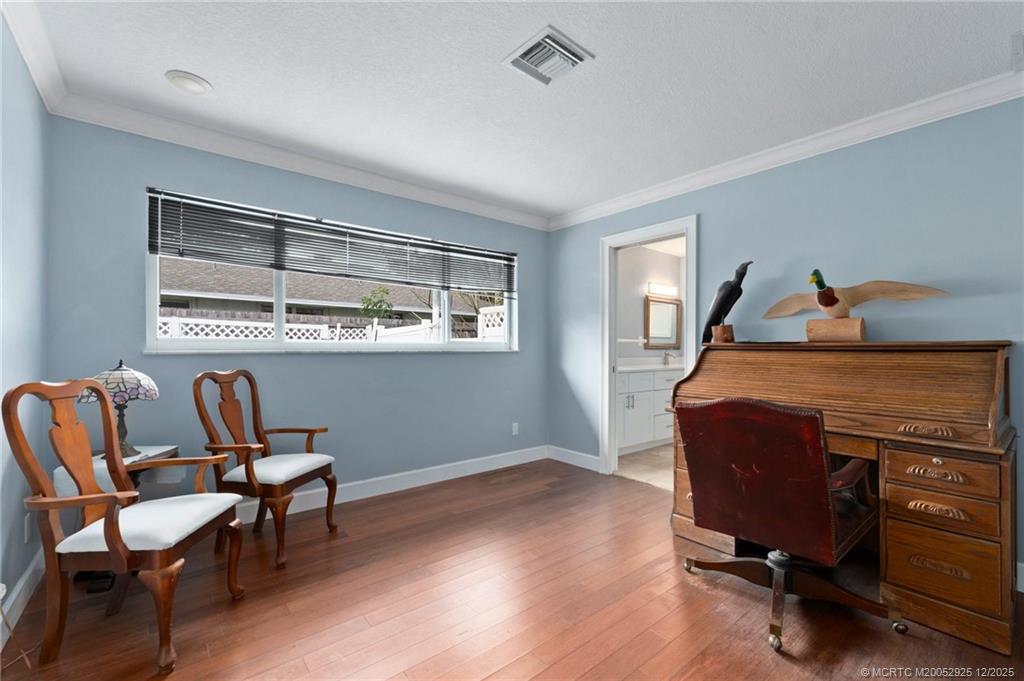 20 Banyan Road Stuart, FL 34996 - Photo 57 of 95 a living room with furniture and a window