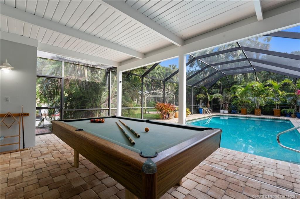 20 Banyan Road Stuart, FL 34996 - Photo 68 of 95 a view of swimming pool with chairs in patio