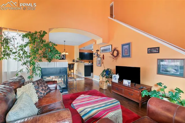 a outdoor living space with furniture and a fireplace