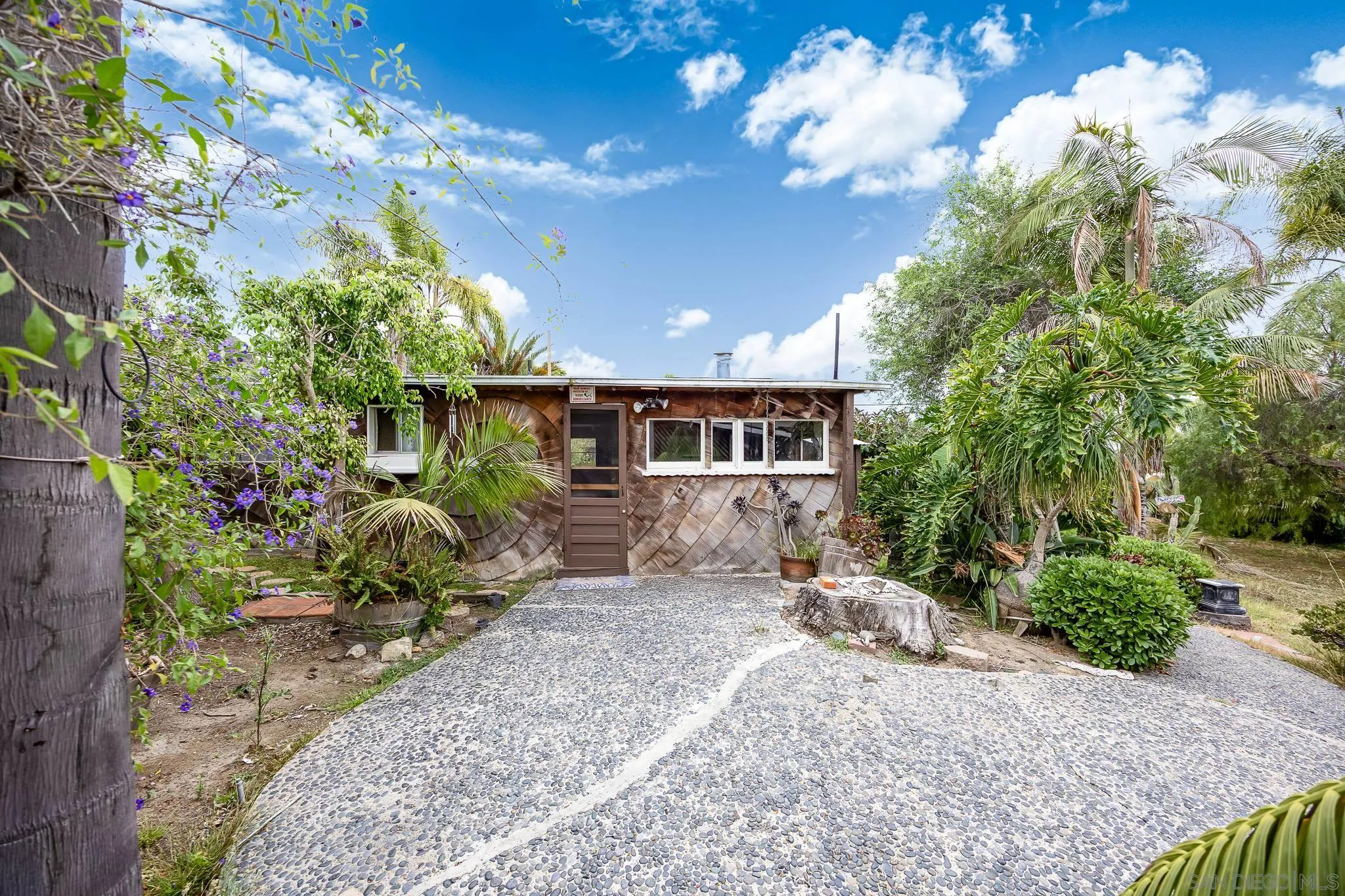 890 Capri Road Encinitas, CA 92024 - Photo 15 of 43 a front view of a house with a yard