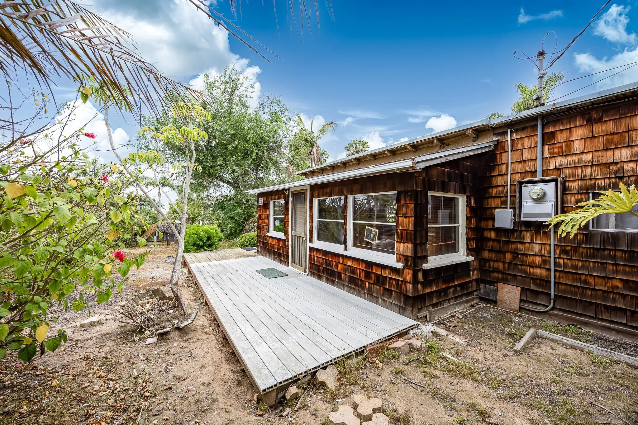 890 Capri Road Encinitas, CA 92024 - Photo 23 of 43 a view of a house with backyard porch and sitting area