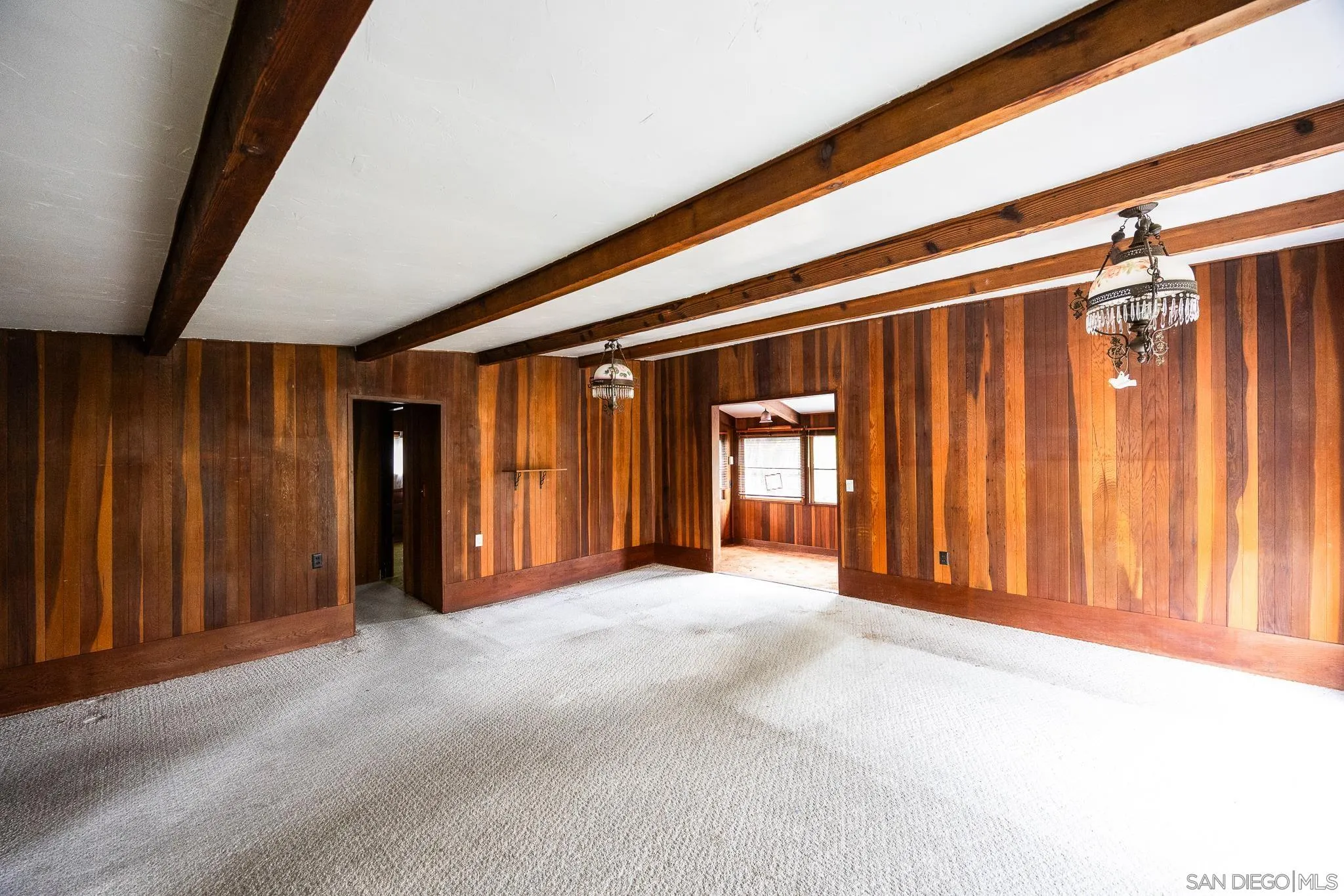 890 Capri Road Encinitas, CA 92024 - Photo 33 of 43 a view of empty room with wooden floor and windows