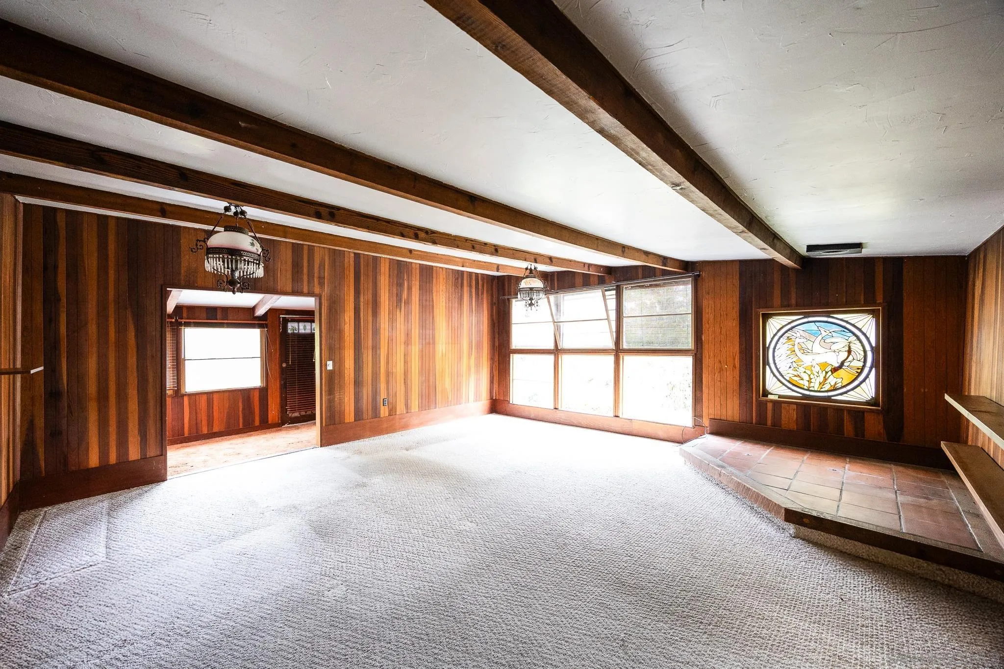 890 Capri Road Encinitas, CA 92024 - Photo 35 of 43 a view of an empty room with a window and fireplace