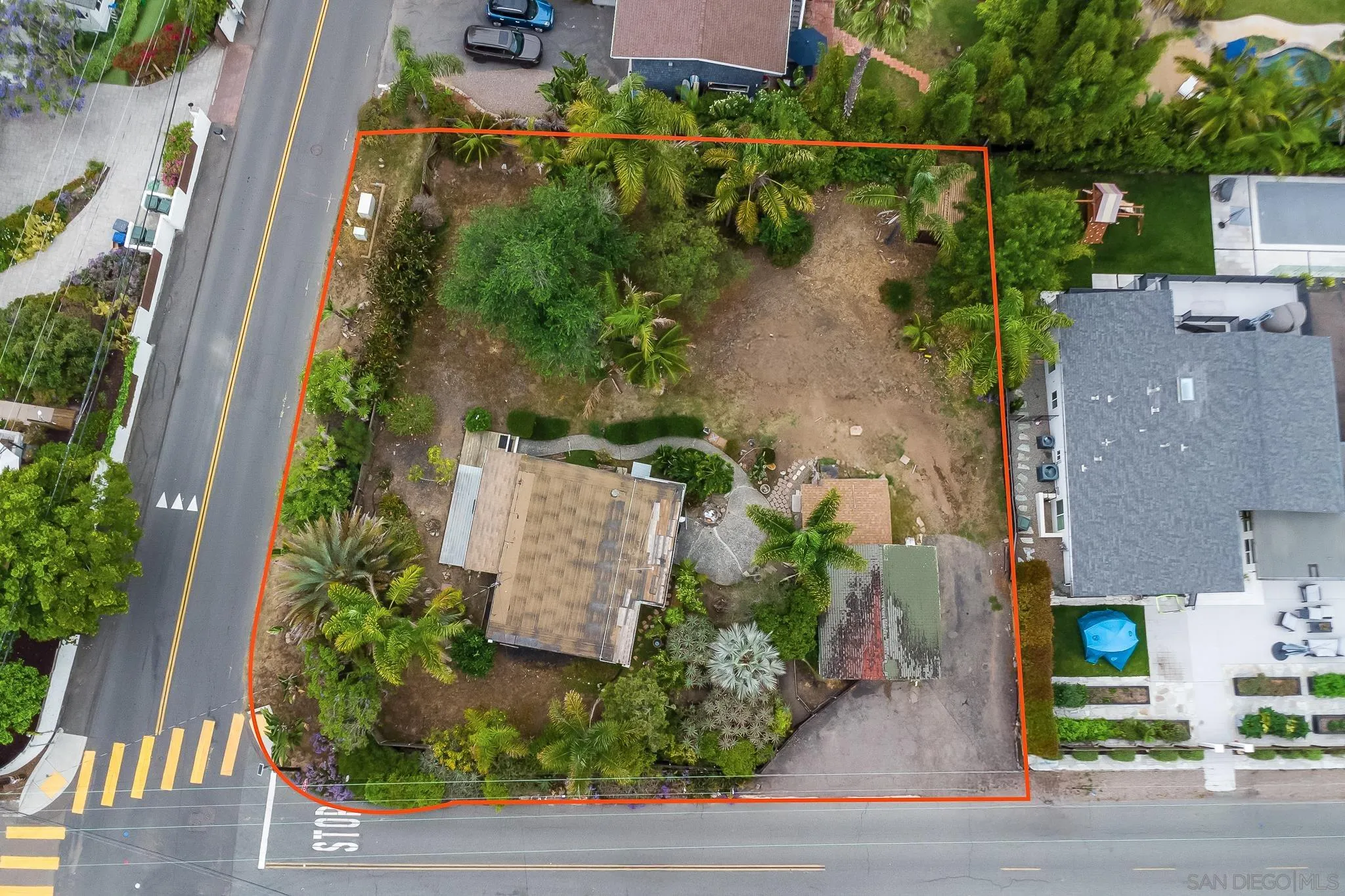 890 Capri Road Encinitas, CA 92024 - Photo 5 of 43 an aerial view of a house with a yard and lake view