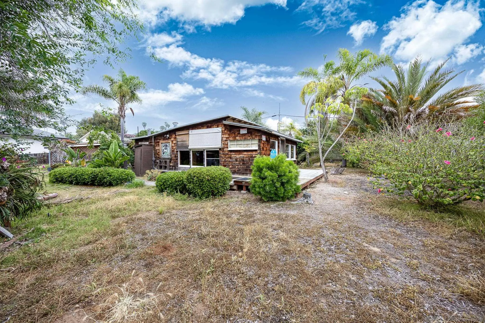 890 Capri Road Encinitas, CA 92024 - Photo 10 of 43 a backyard of a house with lots of green space