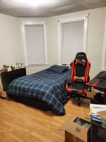 a bedroom with a bed and dresser