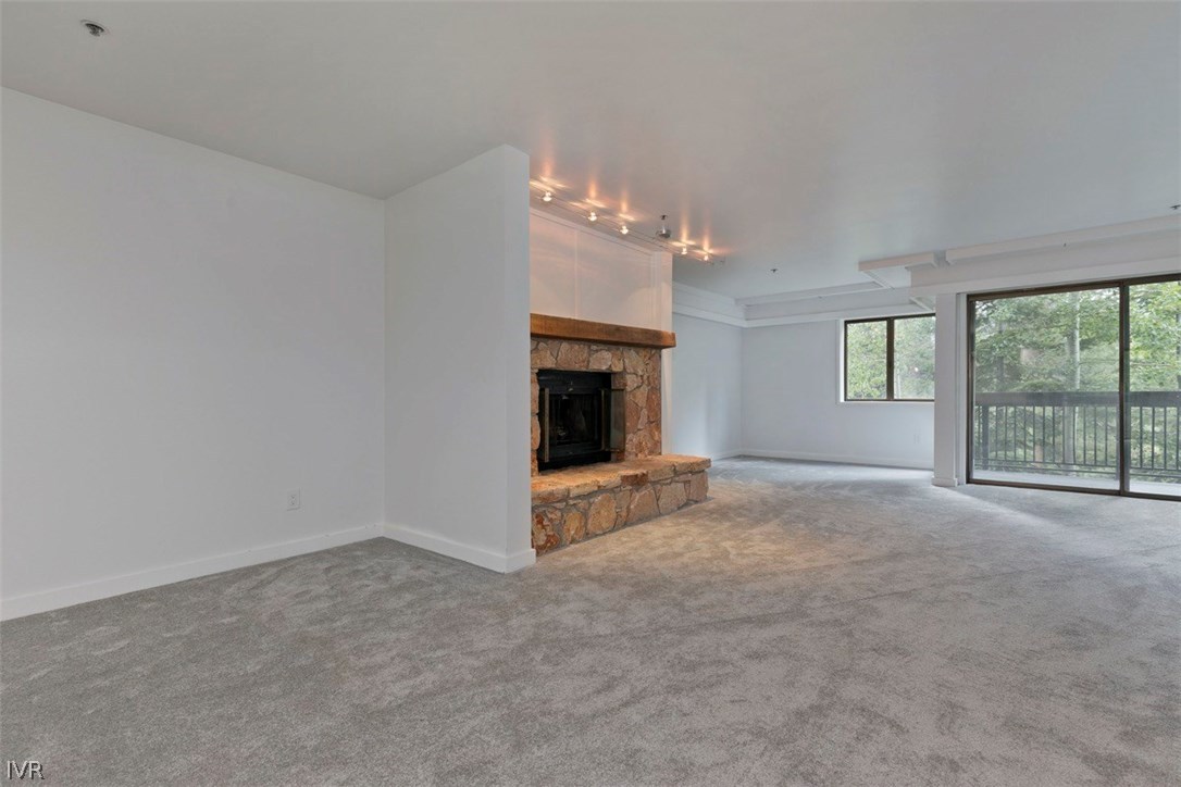 333 Ski Way, Unit 281 Incline Village, NV 89451 - Photo 11 of 35 en empty room with windows and fireplace