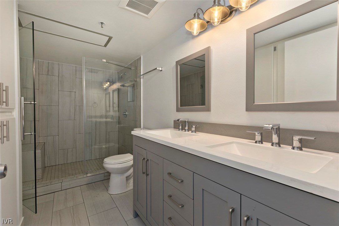 333 Ski Way, Unit 281 Incline Village, NV 89451 - Photo 17 of 35 a bathroom with a double vanity sink toilet and shower