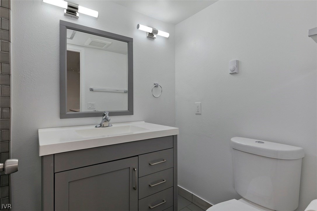333 Ski Way, Unit 281 Incline Village, NV 89451 - Photo 20 of 35 a bathroom with a toilet a sink and mirror