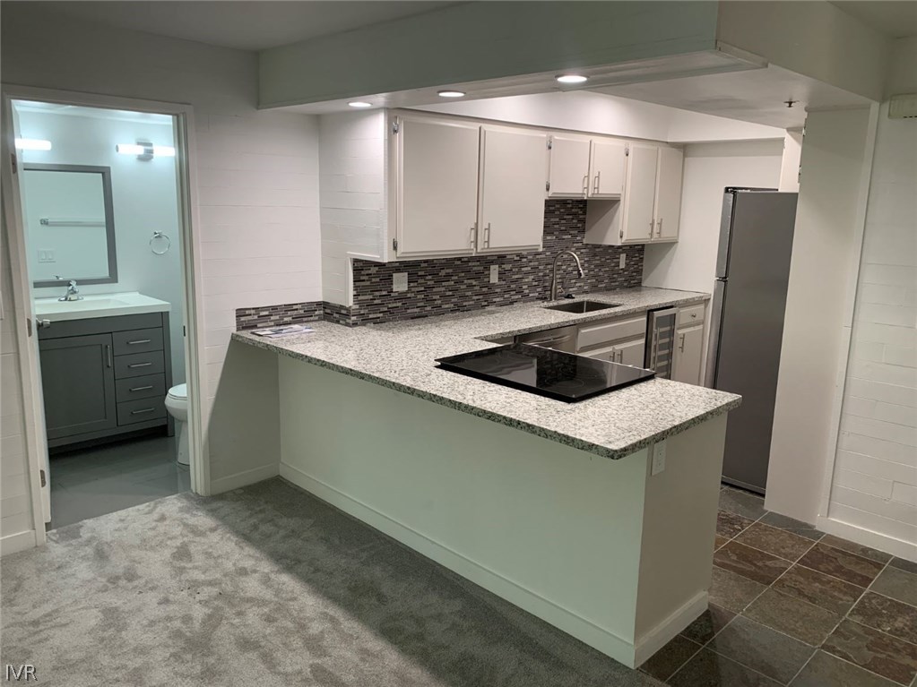 333 Ski Way, Unit 281 Incline Village, NV 89451 - Photo 3 of 35 a kitchen with a sink cabinets and stainless steel appliances