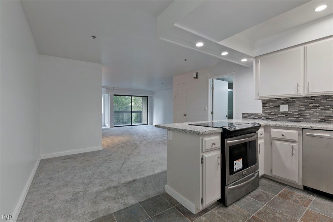 333 Ski Way, Unit 281 Incline Village, NV 89451 - Photo 6 of 35 a kitchen with stainless steel appliances granite countertop a stove and a sink