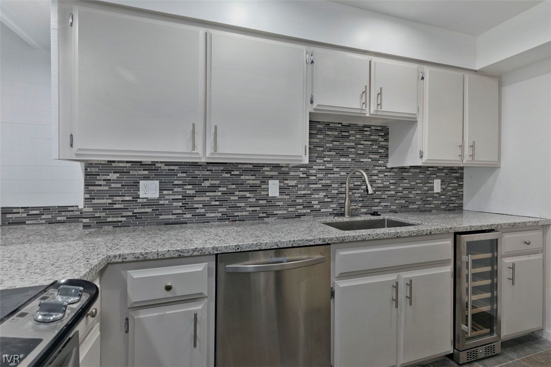 333 Ski Way, Unit 281 Incline Village, NV 89451 - Photo 8 of 35 a kitchen with stainless steel appliances granite countertop a sink stove and cabinets