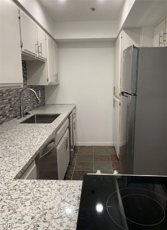333 Ski Way, Unit 281 Incline Village, NV 89451 - Photo 9 of 35 a kitchen with a sink a refrigerator and cabinets