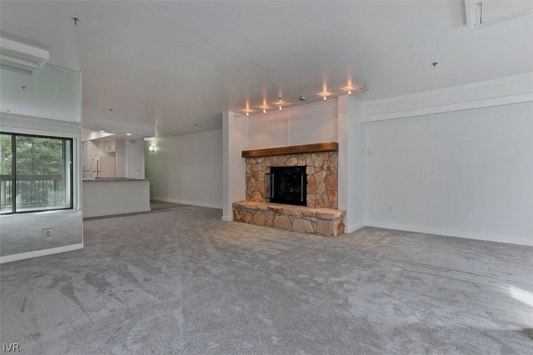333 Ski Way, Unit 281 Incline Village, NV 89451 - Photo 10 of 35 an empty room with a fireplace and window