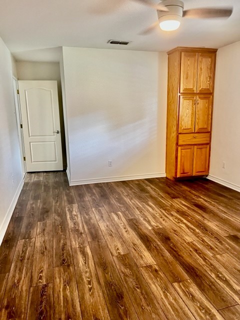 5005 Cascade Drive Corpus Christi, TX 78413 - Photo 11 of 14 a view of empty room with wooden floor and cabinet