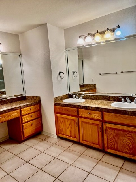 5005 Cascade Drive Corpus Christi, TX 78413 - Photo 12 of 14 a kitchen with stainless steel appliances granite countertop a sink and cabinets