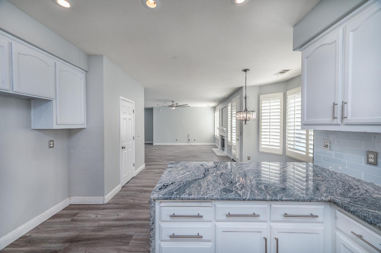 2800 Olympus Court Modesto, CA 95356 - Photo 18 of 56 a bathroom with a granite countertop sink and a mirror