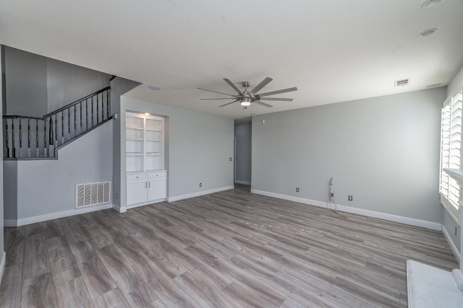 2800 Olympus Court Modesto, CA 95356 - Photo 22 of 56 a view of an empty room with wooden floor and a window