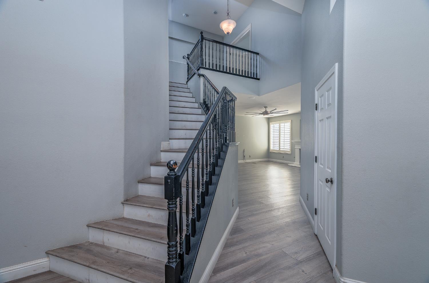 2800 Olympus Court Modesto, CA 95356 - Photo 28 of 56 a view of staircase with wooden floor and stairs