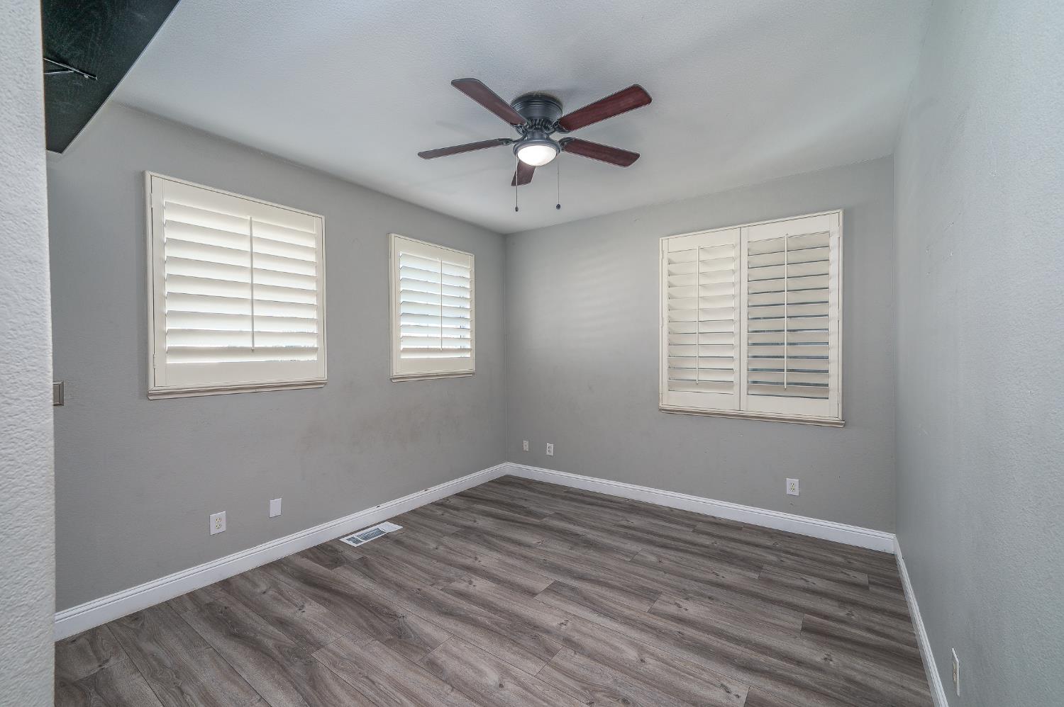 2800 Olympus Court Modesto, CA 95356 - Photo 31 of 56 a view of a room with a ceiling fan and a window