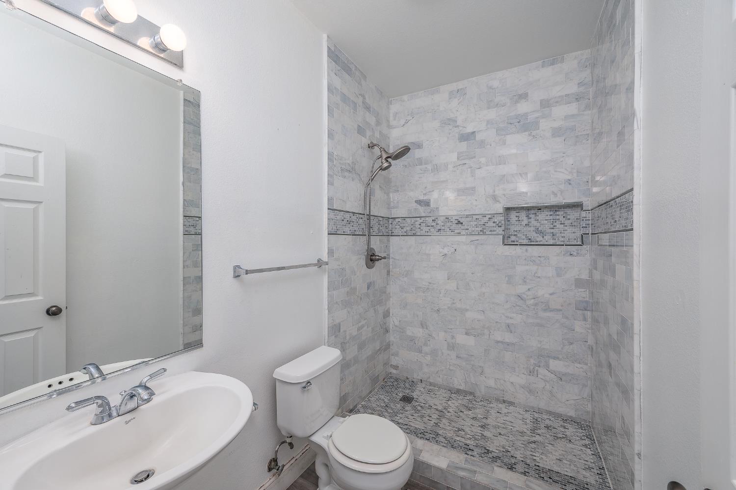 2800 Olympus Court Modesto, CA 95356 - Photo 33 of 56 a bathroom with a sink toilet and shower