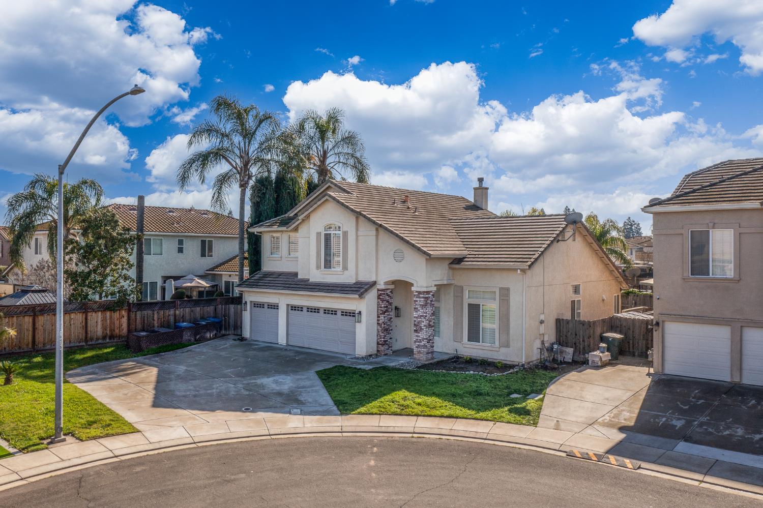 2800 Olympus Court Modesto, CA 95356 - Photo 4 of 56 a front view of a house with a yard and garage