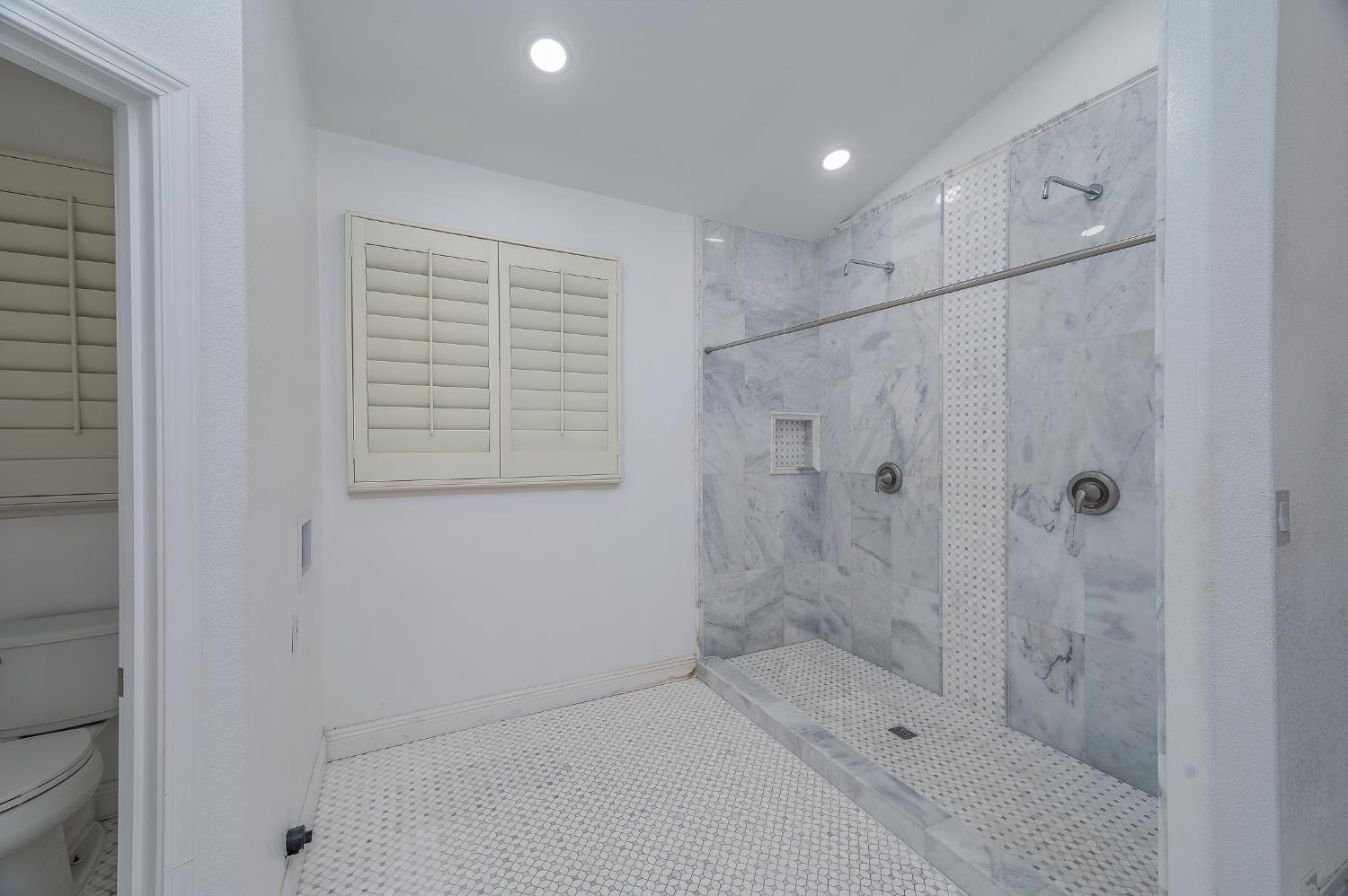 2800 Olympus Court Modesto, CA 95356 - Photo 43 of 56 a bathroom with a shower and a sink