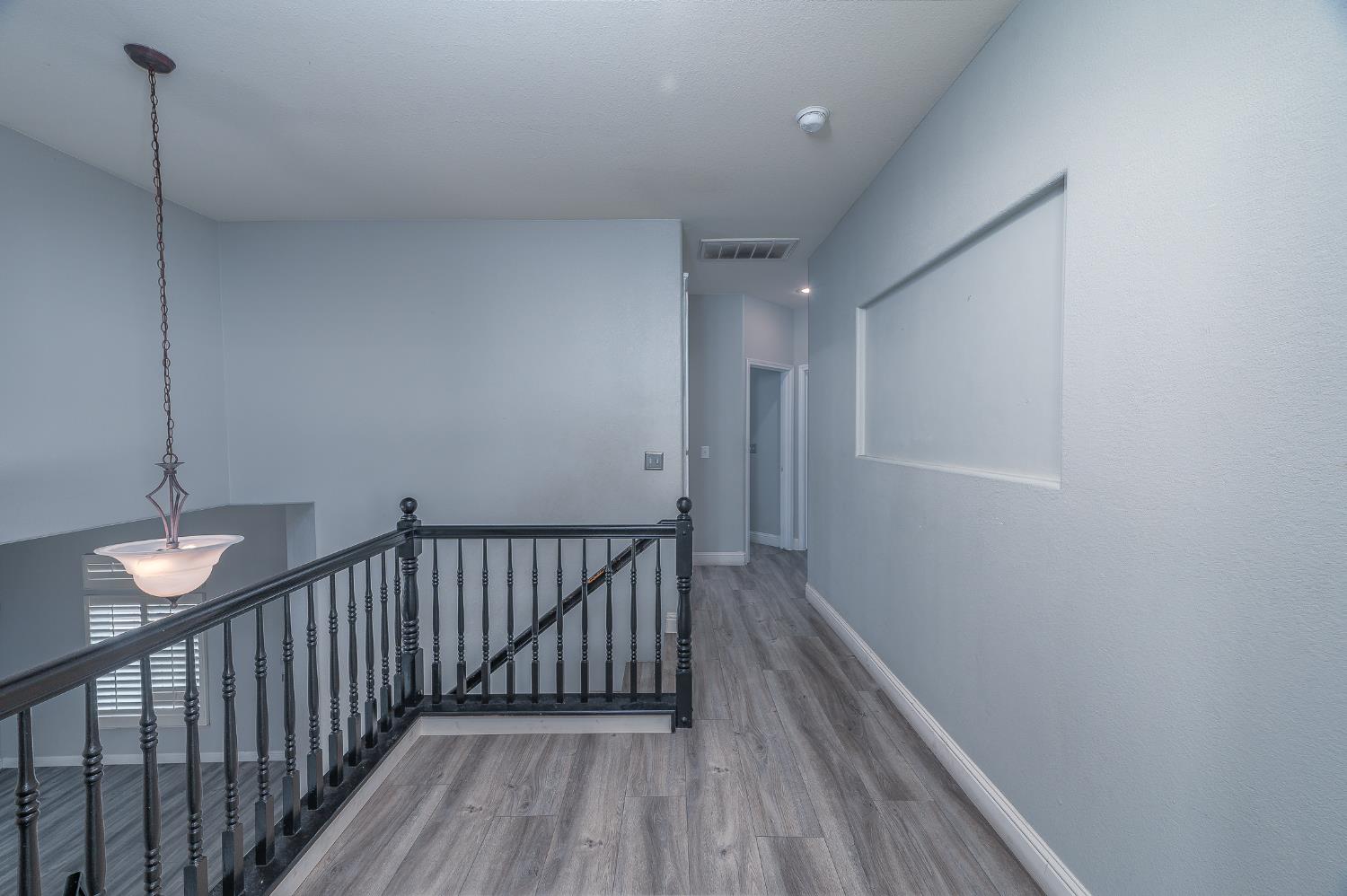 2800 Olympus Court Modesto, CA 95356 - Photo 46 of 56 a view of hallway with wooden floor