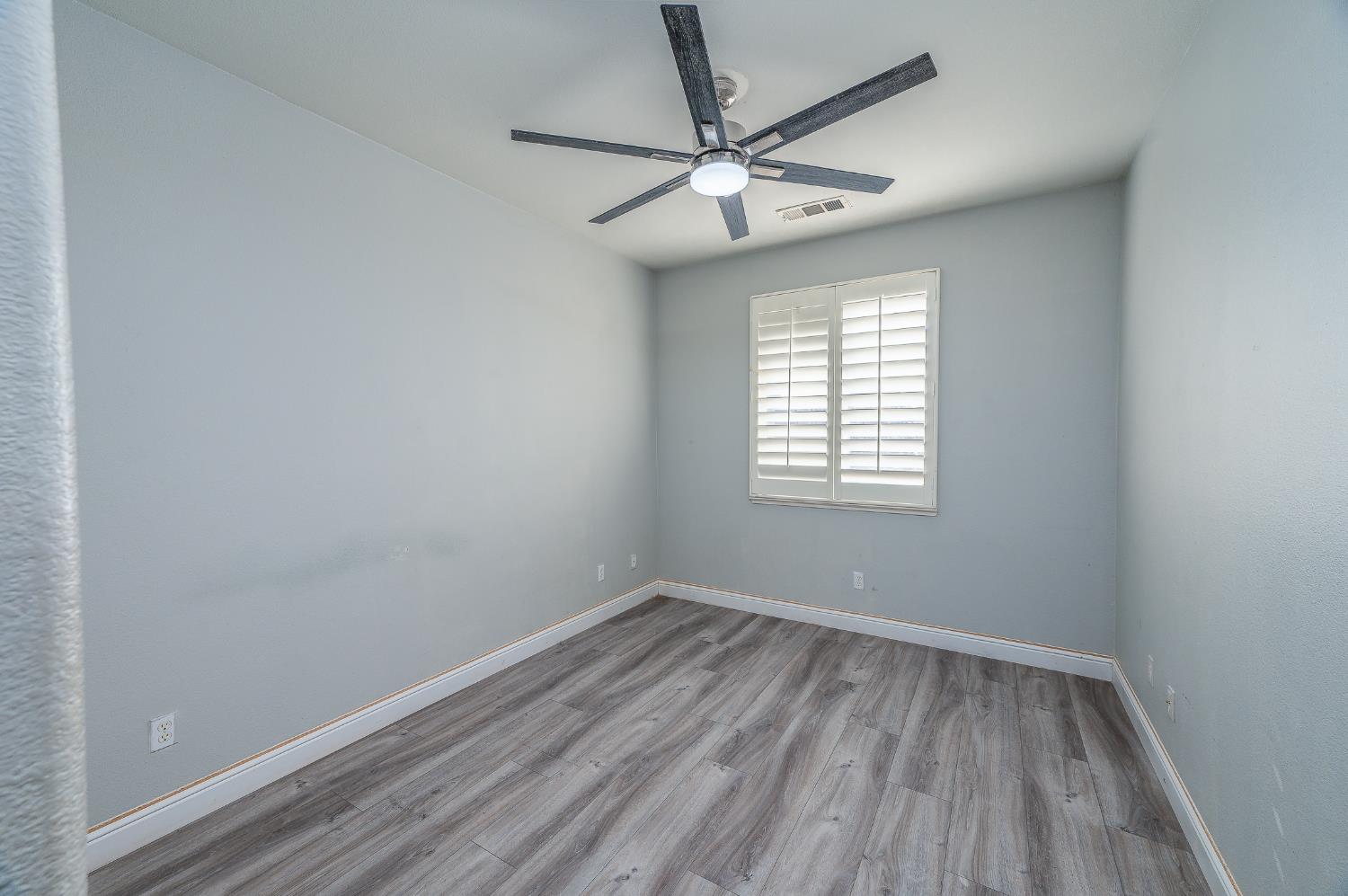 2800 Olympus Court Modesto, CA 95356 - Photo 49 of 56 wooden floor in an empty room with a window