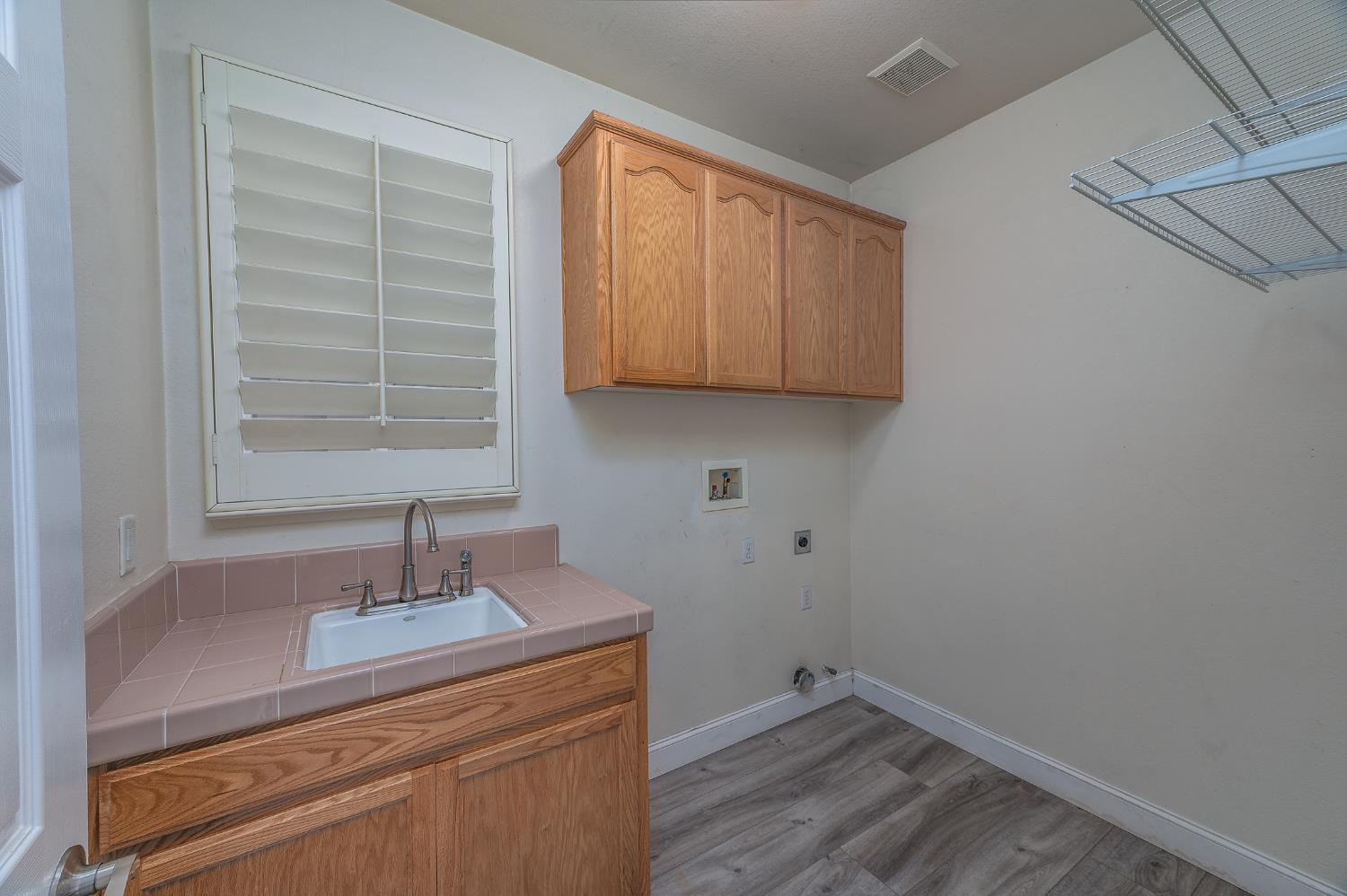 2800 Olympus Court Modesto, CA 95356 - Photo 53 of 56 a room with a sink and cabinets