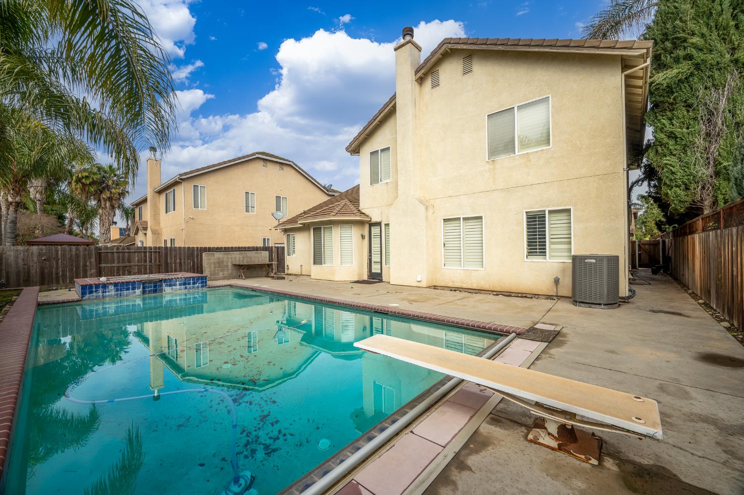2800 Olympus Court Modesto, CA 95356 - Photo 10 of 56 a view of a house with a swimming pool