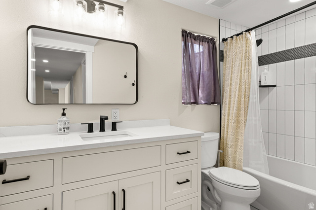 2591 East Washington Dam Road Washington, UT 84780 - Photo 43 of 67 Bathroom featuring a white vanity with integrated sink, quartz countertop, and matte black hardware