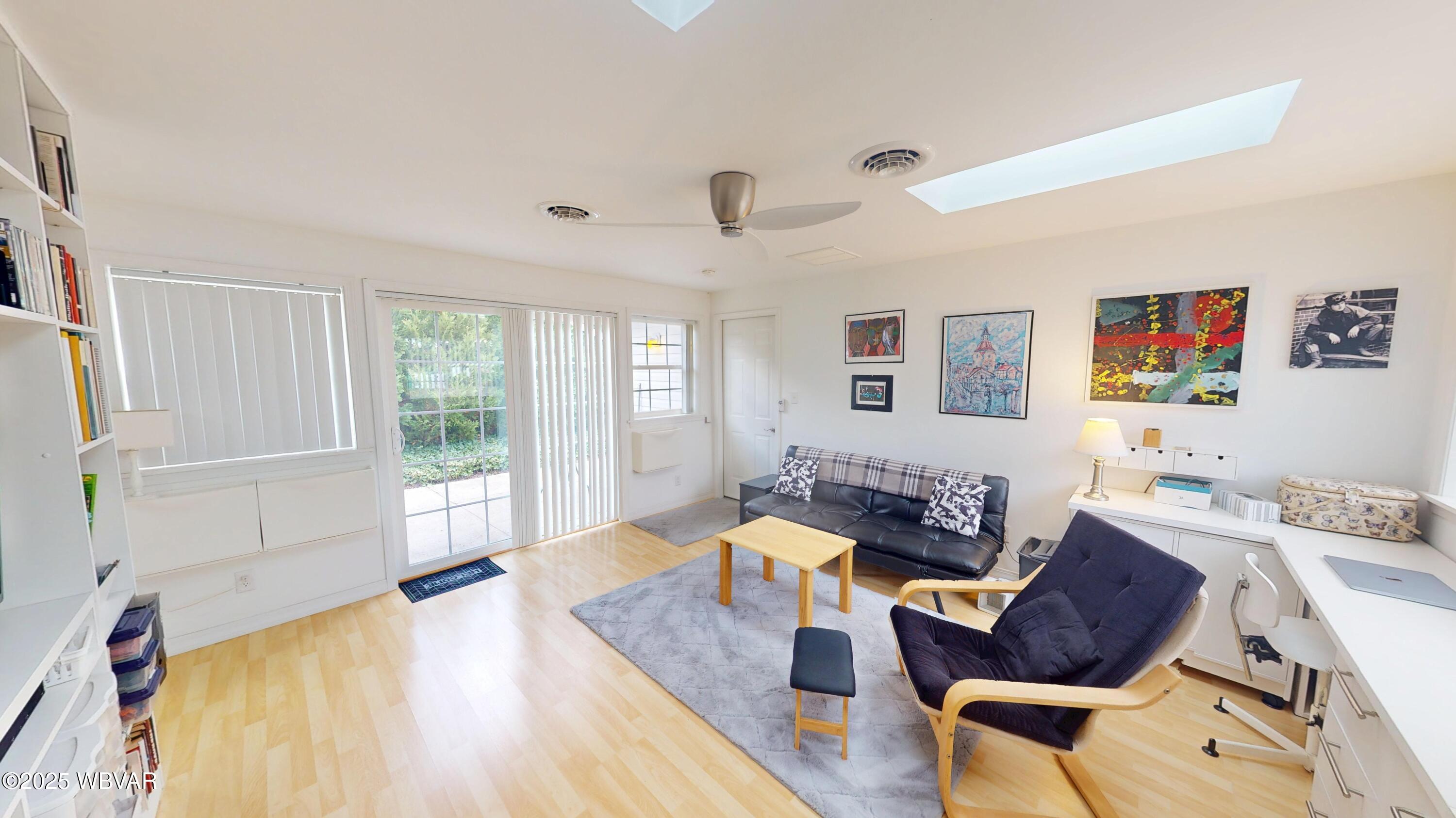 Versatile and inviting, this bright family room (or second bedroom) features laminate floors and sliding doors to a secluded private patio?perfect for relaxing or entertaining
