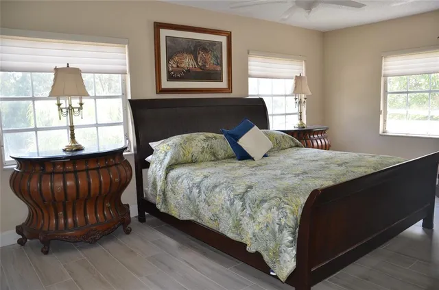 a bedroom with a bed and window