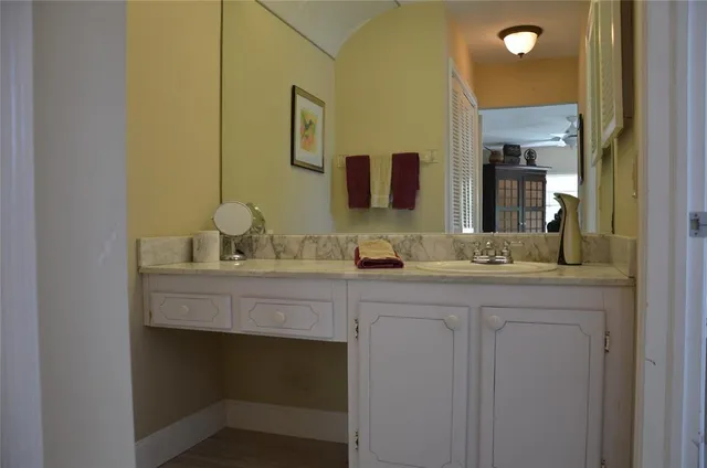 a bathroom with a double vanity sink and a mirror