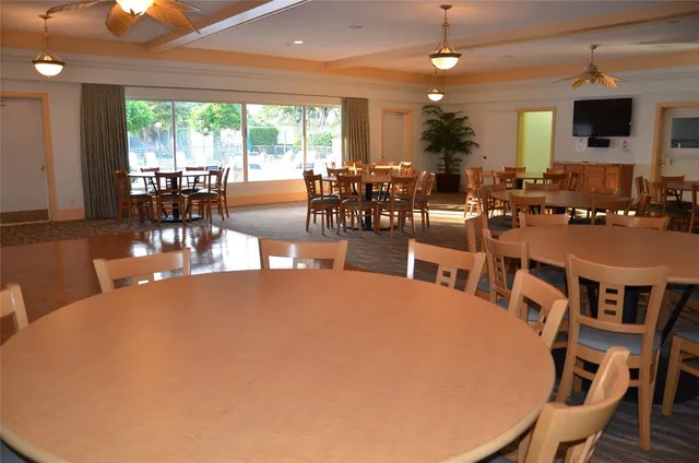 a view of a livingroom with furniture and a book shelf