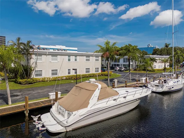a view of a swimming pool with lounge chairs
