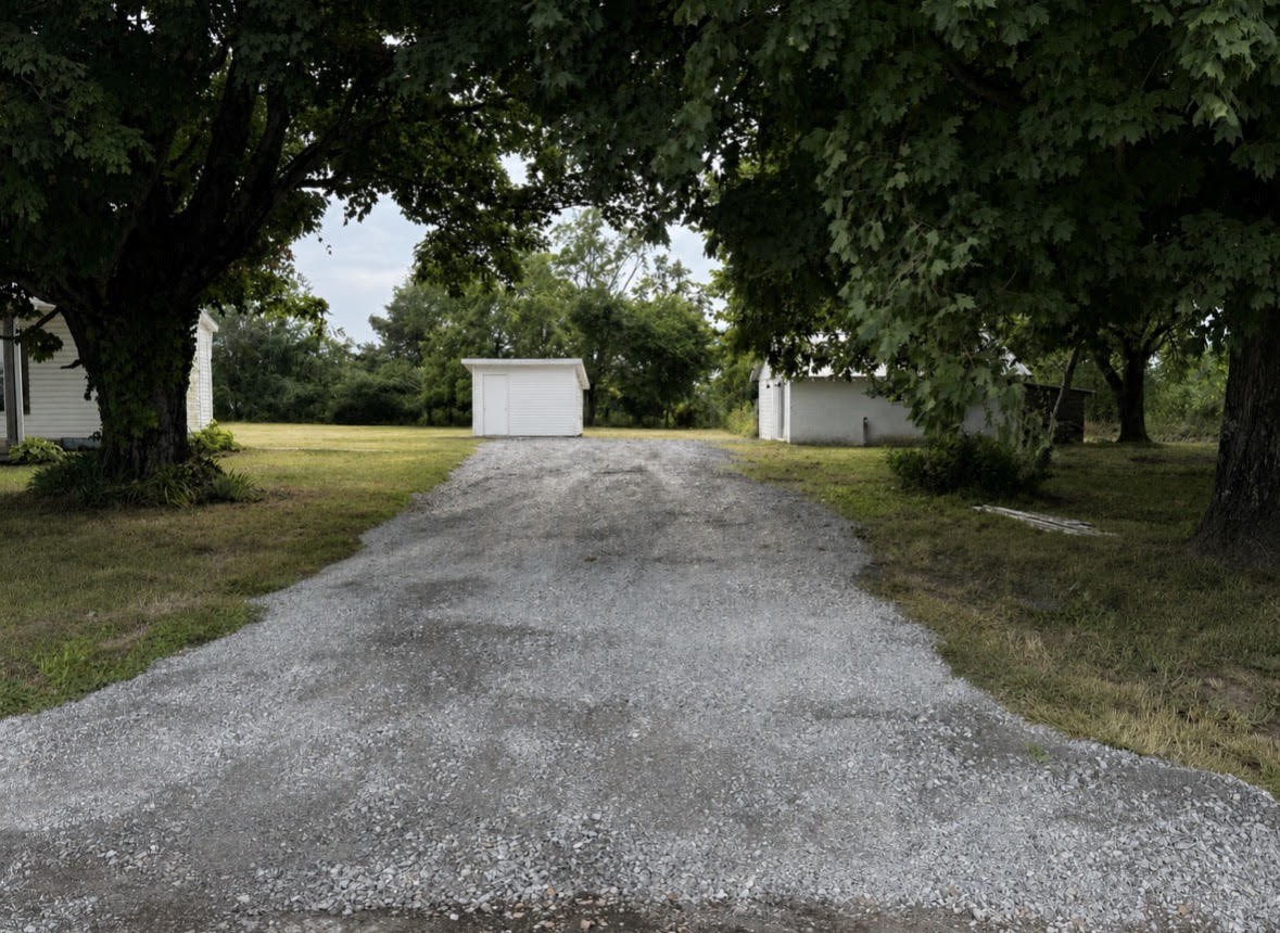 301 Bob Perry Road Bethpage, TN 37022 - Photo 3 of 4 a front view of a house with a yard and a tree